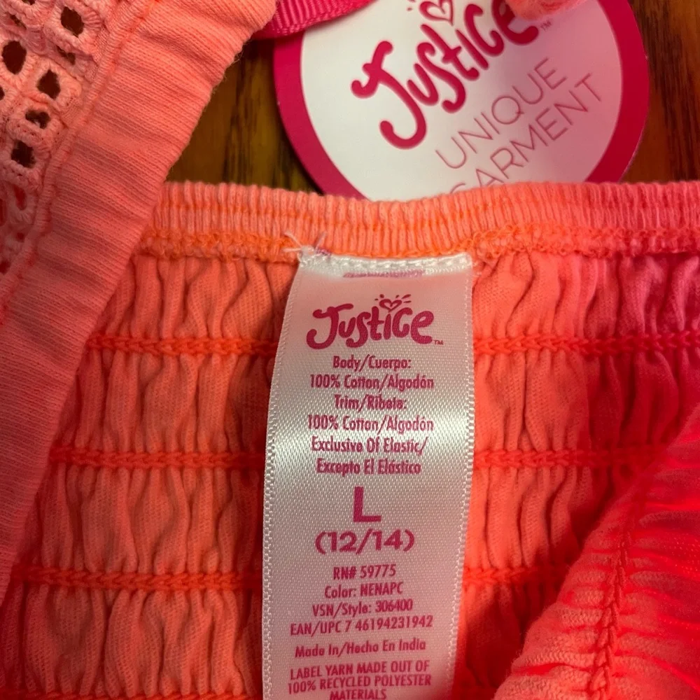 New Justice Girls orange smocked ruffle orange dye top. Size L 12/14